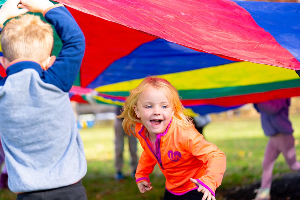 kids playing with parachute