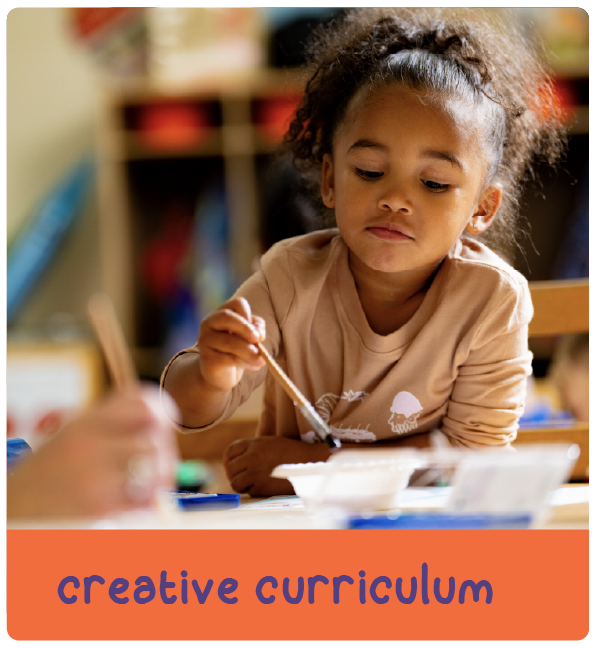 Child painting with a brush with text 'creative curriculum'
